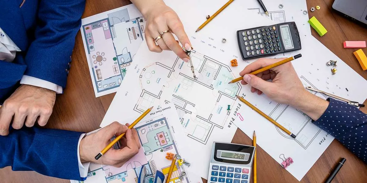 Apex Accuracy Estimating Inc team reviewing construction plans